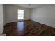 Bedroom featuring hardwood floors and a window with a trellised view at 3209 Abbeywood Dr, Decatur, GA 30034