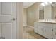 Bright bathroom featuring granite counters, a large mirror, a tile shower, and neutral decor at 110 Greenridge Ct, Fayetteville, GA 30215