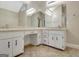 Bathroom featuring a double sink vanity, tile floor, and ample storage at 110 Greenridge Ct, Fayetteville, GA 30215