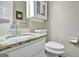 Bathroom features a granite countertop, white cabinet, toilet, and a mirrored vanity at 110 Greenridge Ct, Fayetteville, GA 30215