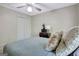 Comfortable bedroom with a ceiling fan, a large closet, and stylish décor at 110 Greenridge Ct, Fayetteville, GA 30215