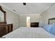 Cozy bedroom with neutral walls, a textured ceiling, and an ensuite bathroom at 110 Greenridge Ct, Fayetteville, GA 30215