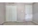 Neutral bedroom featuring a closet, a door, carpeted floors, and base molding at 110 Greenridge Ct, Fayetteville, GA 30215