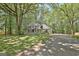 Traditional two-story home featuring a welcoming wraparound porch and a long driveway at 110 Greenridge Ct, Fayetteville, GA 30215