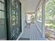 Charming porch featuring classic railings, a decorative front door, and seating at 110 Greenridge Ct, Fayetteville, GA 30215