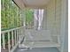 Charming porch swing on a covered front porch, perfect for relaxing outdoors at 110 Greenridge Ct, Fayetteville, GA 30215