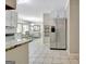 Bright kitchen with stainless steel fridge that opens to breakfast nook at 110 Greenridge Ct, Fayetteville, GA 30215