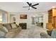 Cozy living room with comfortable seating, media display, and views into adjoining rooms at 110 Greenridge Ct, Fayetteville, GA 30215