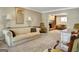Elegant living room showcasing comfortable seating, neutral tones, and seamless flow to the kitchen at 110 Greenridge Ct, Fayetteville, GA 30215