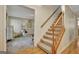 Beautiful staircase leading to the upper level with carpeted steps and wood railing at 110 Greenridge Ct, Fayetteville, GA 30215
