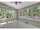 Charming sunroom with tiled flooring and an abundance of windows providing natural light and scenic views at 110 Greenridge Ct, Fayetteville, GA 30215