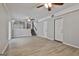 Spacious finished basement with light grey walls, vinyl flooring, and a small kitchen space at 269 Malone Cir, Fairburn, GA 30213
