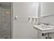 Bathroom with a white sink, hardware, and a glass-enclosed shower stall at 269 Malone Cir, Fairburn, GA 30213