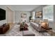 Bright living room with a comfortable seating arrangement, neutral decor, and ample natural light at 269 Malone Cir, Fairburn, GA 30213