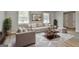 Cozy living room with neutral furniture, a patterned rug, and natural light from the large windows at 269 Malone Cir, Fairburn, GA 30213