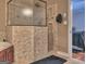 Features a glass-enclosed shower with neutral tile work, plus a glimpse into the bedroom, all in a home bathroom at 678 Oak Grove Rd, Mcdonough, GA 30253