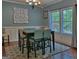 Elegant dining room with a large window and ample natural light at 678 Oak Grove Rd, Mcdonough, GA 30253