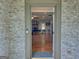 Inviting entryway leading to a spacious living area with hardwood floors and a fireplace at 678 Oak Grove Rd, Mcdonough, GA 30253