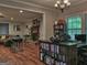 Bright living area with hardwood floors, open to kitchen, and fireplace at 678 Oak Grove Rd, Mcdonough, GA 30253