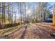 Backyard view of a wooded lot with a fence at 812 Bartow Ct, Riverdale, GA 30274