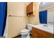 Bathroom featuring a toilet, vanity, mirror, and a medicine cabinet at 812 Bartow Ct, Riverdale, GA 30274