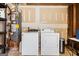 Laundry room with a washer, dryer, and water heater at 812 Bartow Ct, Riverdale, GA 30274