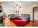 Spacious living room with a bright red rug, hardwood floors, and comfortable seating at 812 Bartow Ct, Riverdale, GA 30274