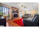 Inviting living room features hardwood floors, stone fireplace, and comfortable seating at 812 Bartow Ct, Riverdale, GA 30274