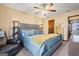 Relaxing bedroom featuring a large bed with a padded headboard and stylish decor at 812 Bartow Ct, Riverdale, GA 30274