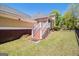 Backyard view with a two-level deck, a grassy area, and mature trees at 140 Campaign Trl, Fayetteville, GA 30214