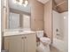 Neutral bathroom featuring a single sink vanity, toilet, and a shower-tub combo at 140 Campaign Trl, Fayetteville, GA 30214