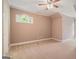 Bedroom with a vaulted ceiling and a quaint arched window to let in natural light at 140 Campaign Trl, Fayetteville, GA 30214