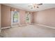 Spacious bedroom with plush carpeting and bright windows at 140 Campaign Trl, Fayetteville, GA 30214