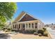 Charming home exterior with a covered front porch and mature landscaping at 140 Campaign Trl, Fayetteville, GA 30214