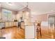 Bright kitchen featuring custom cabinets, granite countertops, and stainless steel appliances at 140 Campaign Trl, Fayetteville, GA 30214