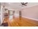 Spacious, open-concept living room with gleaming hardwood floors and lots of natural light at 140 Campaign Trl, Fayetteville, GA 30214
