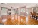 Open-concept living room with fireplace and hardwood floors at 140 Campaign Trl, Fayetteville, GA 30214