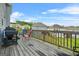 Back deck with grill and outdoor seating, overlooking the neighborhood and green backyard space at 130 Sycamore Row, South Fulton, GA 30331