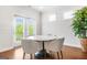 Breakfast nook with natural light, round table, chairs and nearby access to the outdoor deck at 130 Sycamore Row, South Fulton, GA 30331