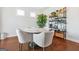 Cozy breakfast nook with a round table, chairs, and decorative shelving unit at 130 Sycamore Row, South Fulton, GA 30331