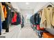 Walk-in closet with ample storage space, shelving, and shoe racks for organization at 130 Sycamore Row, South Fulton, GA 30331