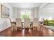 Elegant dining room with hardwood floors, chandelier, and views of a living area at 130 Sycamore Row, South Fulton, GA 30331