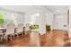 View of the dining area and open floor plan with elegant furnishings and hardwood floors at 130 Sycamore Row, South Fulton, GA 30331