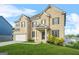 Stunning two-story brick home with a well-manicured lawn and attached two-car garage at 130 Sycamore Row, South Fulton, GA 30331