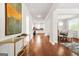Bright entryway features gleaming hardwood floors and a view into the kitchen and dining area at 130 Sycamore Row, South Fulton, GA 30331