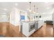 Modern kitchen features a large island, stainless steel appliances, and plenty of storage at 130 Sycamore Row, South Fulton, GA 30331
