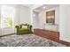 Bright living room featuring hardwood floors, stylish decor, and a comfortable green chair at 130 Sycamore Row, South Fulton, GA 30331