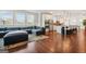 The open living room shows off the wood floors and blends seamlessly into the kitchen area at 130 Sycamore Row, South Fulton, GA 30331