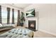 Cozy sitting room includes a warm fireplace, comfortable seating, and natural light at 130 Sycamore Row, South Fulton, GA 30331