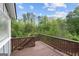 Back deck perfect for enjoying the outdoors, surrounded by lush trees and greenery at 1953 Azure Grove Ct, Marietta, GA 30008
